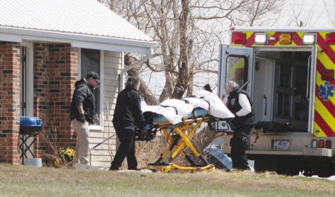 Emergency Medical Technicians remove the body of 25-year-old Eden One Feather of Little Eagle from House 449 on D Street in Timber Lake last Friday, April 14. Authorities discovered One Feather’s body after being dispatched to the residence for an unresponsive female. The FBI has taken over the case and No charges or names of two individuals taken into custody at the residence have been released by law enforcement or the U.S. Attorney’s Office. Photo by Jon Flatland
