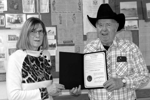 Ziebach County Auditor Cindy Longbrake (LEFT) presents Clint Farlee with a proclamation declaring December 29, 2022 as Clint D. Farlee Day in South Dakota. Photo by Patty Peacock