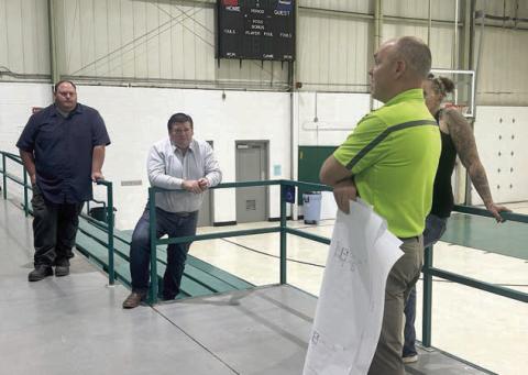 Isabel Board of Trustees members Darrel Pfaff (left) and Ryan Maher (center) discuss HVAC improvements at the Isabel Community Center with Travis Sichmeller of Sichmeller Engineering of Aberdeen. The board approved moving ahead with acquiring a complete estimate from Sichmeller for the proposed improvements. Photo by Jon Flatland