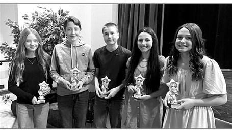 Timber Lake Middle School students who earned a 4.0 (A) average for the 2022-23 school year received trophies at Awards Day on May 3. L-R are Grade 6 - Marcella Handeland; Grade 7 - Landen Bieber; and Grade 8 - Thomas Holzer, Ruby Maher and Jaylee Schoelerman.