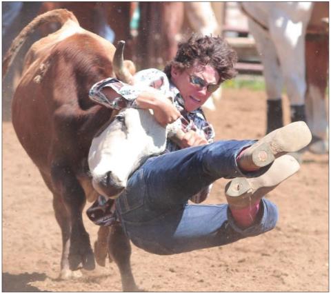 Dupree’s Bobby Brewer has his steer by the horns during the Dupree region rodeo last weekend. Photo by Jon Flatland