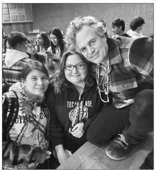Cheyenne-Eagle Butte students Mary Francen and Roslie Lone Eagle pose with actor/activist Mark Ruffalo at the C-EB School on Monday. Ruffalo, executive producer of the documentary film “The Lakota Nation vs. U.S. of America” visited to promote the film and to listen to the concerns of elders. Photo courtesy of Rhonda Swan