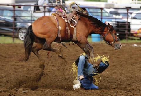 Dupree’s Charg Hebb gave the crowd a scare when he fell awkwardly on his way off his ranch bronc horse Saturday in Timber Lake. Photo by Jon Flatland