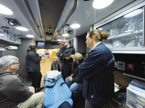 The Timber Lake ambulance crew listens to trainer Sarah Barch, left, during a March 28 training session on the new Avel equipment installed in the ambulance. The equipment remotely connects EMT’s to medical professionals at a virtual health care center in Sioux Falls.