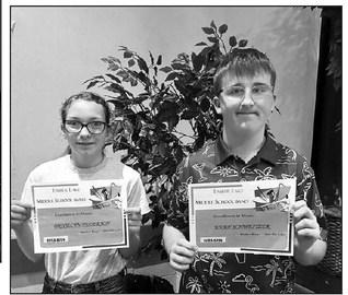 L-R: Bricelyn Pederson and Evan Schweitzer received the Middle School Band Excellence Awards presented by music teacher Walker Rose.