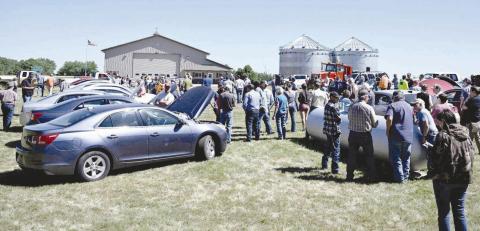 Bidders and lookers gathered at Isabel for the sale of Northwest Area Schools property on June 30. Photo by Marie DuPreez