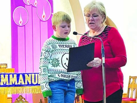 Ann Crance and grandson Isaac Schweitzer sang “The Little Drummer Boy” accompanied by Sarah Schweitzer on piano, Evan Schweitzer on drums, and Owen Schweitzer on guitar.