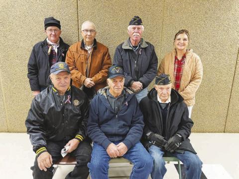 Six local veterans and one active duty member were recognized at the Veterans Day program held at the Timber Lake School on November 8. FRONT (L-R): John D. Boldt, Val Schweitzer, Andy Aberle; BACK: Keith Dorsey, Larry Gill, Jack Bickel and Veronica Handeland (active duty with the U.S. Public Health Service Commissioned Corps.)