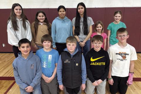Local Knights of Columbus Hoop Shoot competitors include (front L-R) Jett Fiddler, Monroe Kraft, Austin Lindskov, Karter Lindskov, Luke Beer; (back, L-R) Kylie Lawrence, Aliviah Schambriel, Oaklee Mutchler, Autym Red Bear, Harper Biegler, Raelyn Quaschnick. Not pictured is Vern Long. Topic Photo/ Kathy Nelson