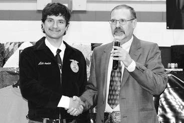 Alan Lemke (LEFT) receiving the Dekalb Senior Ag Accomplishment Award from Advisor Doug Hofer.