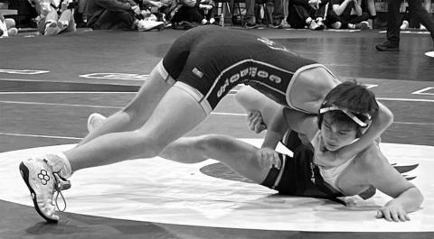 Blake Lei, bottom,, works to get free from a hold applied by Hettinger-Scranton’s Nick Dobitz during a 127 pound match at the Hettinger (ND) Wrestling Classic on Saturday, Jan. 10. Lei ended up losing the match by pinfall but finished fourth overall in his division. Also finishing fourth in their respective classes for the Timber Lake boys were TK Paxton and Isaac Zeug, while on the girls side, Lilly Veit captured a bronze medal with a third place showing. Photo by Denise Perryman