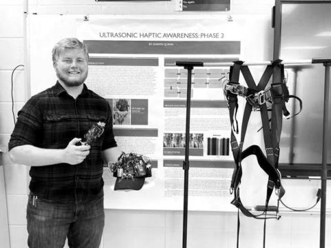 Shawn Quinn shows his winning project, “Ultrasonic Haptic Awareness: Phase 2,” which won him a trip to the Regeneron International Science and Engineering Fair in Los Angeles next month.