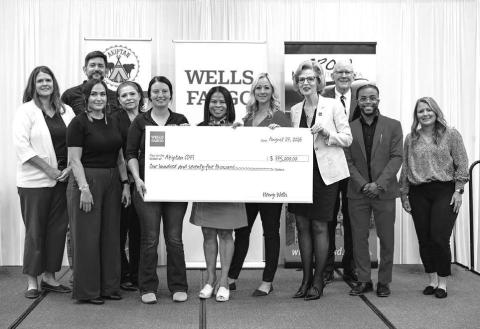 Attending the presentation of a check for $175,000 to Akiptan are Front, l-r: Dawn LeBeau, Akiptan; Skya Ducheneaux, Akiptan; Cristina Castro-Matukewicz, Wells Fargo; Maggie Reiffenberger, Wells Fargo; Patty Pannkuk, Wells Fargo; Jamal Spruiell, Wells Fargo; and Amanda Clark, Wells Fargo; Back: Melinda Reints, Wells Fargo; Bob Butterdrodt, Wells Fargo; Angie Marshall, FHLB Advisory Board; and Pete Mehlaff, FHLB Advisory Board.