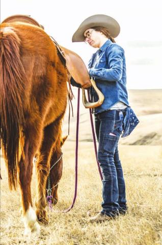 Kelsey Ducheneaux, co-owner of DX Ranch near LaPlant, models some of the new women’s ranchwear clothing line she and her crew inspired and influenced for Dovetail Workwear, a women-owned clothing label based in Portland, OR. Photo courtesy of Dovetail Workwear