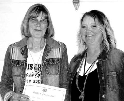 Past DHS Alumni Board member Cindy Longbrake (LEFT) receiving recognition for her many years of service to the DHS Alumni Assoc from DHS Alumni Board member Robyn DePoy..