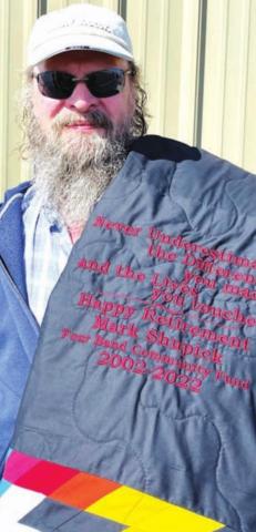 Mark Shupick was presented with a star quilt recognizing his years with Four Bands Community Fund.
