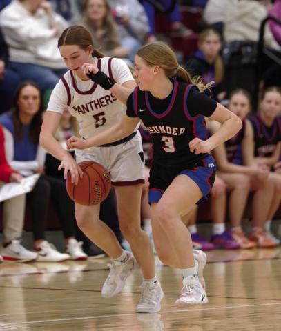 Josie Boldt (5) knocks the ball away from Carleigh Dosch (3) of North Central on Saturday, Jan. 31, when the Lady Panthers hosted the Thunder. Topic Photo/Marie DuPreez