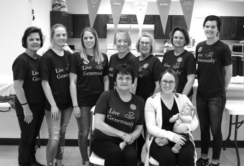 The group working to open a community day care center in McIntosh held a meatball dinner fundraiser in the McIntosh City Hall on Sunday, April 25, raising more than $1,700 toward the effort. Organizing and serving the meal were FRONT (L-R): Deb Nehl and Melissa Day holding baby Harper; BACK: Connie Maier, Annie Walker, Kelli Nehl, Kristy Seiler, Cathy Evans, Sandy Baumberger and Tia Nehl. Photo by Jon Flatland