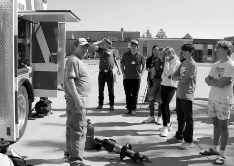 Grady Kraft of the Timber Lake Fire Department answers questions about the department’s trucks and geat from students participating in the Freshman Impact program at the Timber Lake School on Monday, Sept. 16. Also involved in the program was the Isabel Fire Department. Photo by Jon Flatland