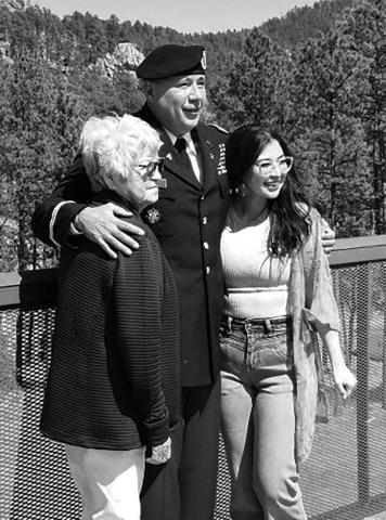 Halsey Hall, a member of the Cheyenne River Sioux Tribe, with his mother, Lorita Hall of Timber Lake, and his daughter Halle of Rapid City, at his promotion ceremony at Crazy Horse Monument at Custer. US Army National Guard photo by Col. Scott Linquist