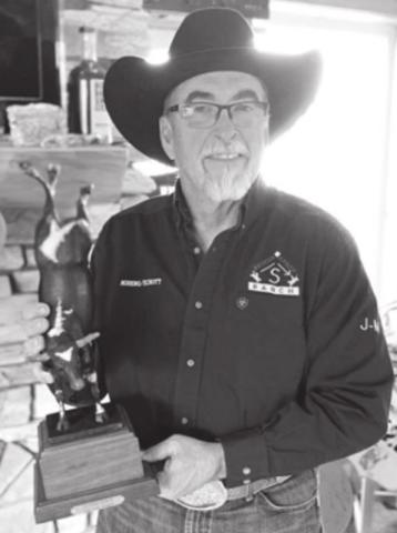 Dallas Schott with the bronze of the bucking bull Spotted Demon