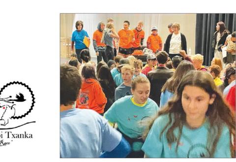 Middle and high school students took off from the theater after receiving their assigned T-shirts and leaders.