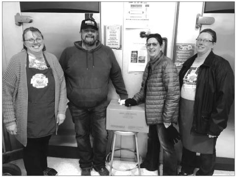 The Timber Lake School kitchen staff received the first shipment of donated beef from the Cheyenne River Farm to School program on March 4. L-R are Diane Goldade, Jayme Murray (irector of the Farm to School Program), Peg Ley, and Robin Hinsz. The beef was donated by Pat and Kasey Maher of Timber Lake.