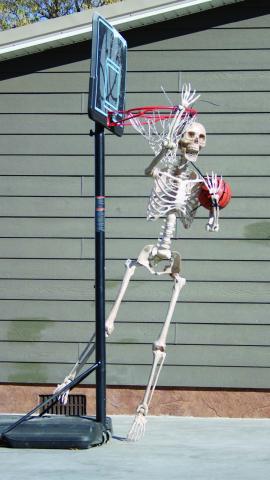 With Halloween and hoops season just around the corner, a skeleton hangs around the Brent and Kaleigh Biegler residence in Timber Lake looking for a game of “horse.” Photo by Jon Flatland