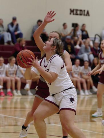 Kate Biegler prepares to put up a shot during a Timber Lake girls basketball game from Newell during the 2025-26 season. Photo by Marie DuPreez