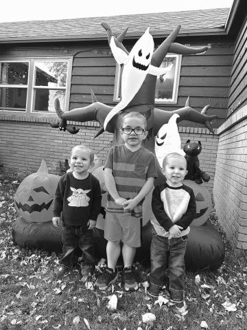 Ryker Bridges and his twin brothers, Rhett (LEFT) and Rowan, are ready for Halloween. Mom and Dad, Pelagie and Wesley, helped them with the blow-up decorations but no one is saying what costumes they will be wearing for the Halloween parties and trick-or-treating.