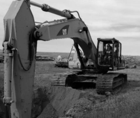 AT RIGHT: McIntosh student Hanna Nix operating an excavator. Students also learn to operate a bulldozer and wheel loader.