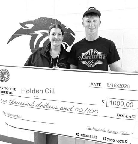 The Timber Lake Booster Club awarded its first-ever scholarship in the amount of $1000 to Holden Gill, a 2026 graduate of Timber Lake High School. The son of Bryan and Kristen Gill, Holden (right) is attending Bismarck State College in Bismarck, ND. Megan Bickel of the Booster Club made the presentation.