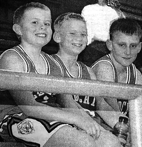 With one win under their belt and anticipating their next game, friends Sean Meginness, William Orndorff and Kilby Rech relax during the triangular with Bison and Timber Lake played at Isabel Monday, Dec. 1. Isabel Dakotan, December 4, 2003