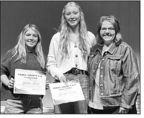 Dewey Co. 4-H Advisor Rita Long (RIGHT) presented $250 4-H scholarships to Kenlea Heck (LEFT) and Kendyl Locken.