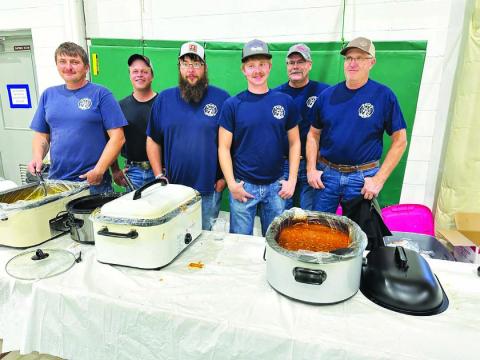 Serving up homemade chili and chicken noodle soup are Isabel Volunteer Firefighters L-R: Brent Spafford, Tony Russell, Patrick Bridges, Riley Lindskov, Lynn Stradinger, and Bill Lindskov.