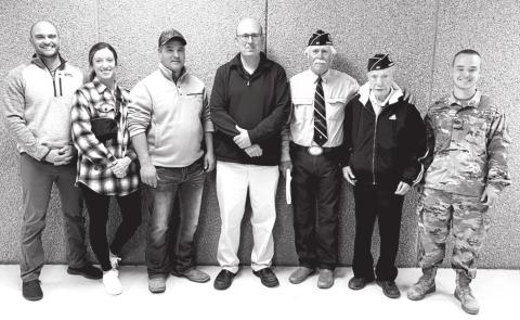 Veterans and active military personnel recognized at the Timber Lake Middle/High School Veterans Day program on November 10 were (L-R): Major Jason Booth (active US Air Force); Kay Booth (active US Air Force); Adrian Winterberg (US Army); Dan Martin (Army National Guard); Jack Bickel (US Army); Andy Aberle (US Army); and Jesse Winterberg (active SD National Guard).