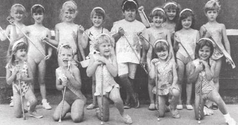 The Timber Lake Majorettes have been practicing for the Days of 1910 parade. Pictured are FRONT (L-R): Alicia Schweitzer, Becky Goldade, Suzanne Goldade, Jamie Maher, Heaven Winterberg; BACK: Theresa Crance, Ikea Pfeifle, Ashley Dahlgren, Erin Linderman, Jenna Holzer, Vicki Linderman, Carmen Maher, Jennifer Wimmer, Heather Schmidt. NOT PICTURED: Holly Maher and Shawana Winterberg. (Timber Lake Topic, July 11, 1991)