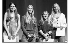 Junior Meredith Maciejewski (left) received a bronze award for her interactive bulletin board, and seniors (l-r): Averie Marshall, Kenlea Heck, and Kendyl Locken received honor cords to wear at graduation.