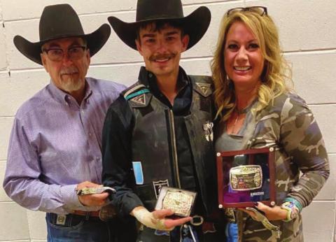 Bringin’ home the buckles Chance Schott of McLaughlin (ABOVE CENTER), pictured with his father, Dallas Schott, and Robin Blankenship, and Trey Young of Dupree (AT RIGHT) did well at the Badlands Circuit Finals rodeo in Minot Oct. 9-11.