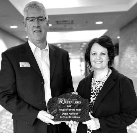 Dana Keffeler (RIGHT), owner of Keffeler Kreations in Faith, received the Retailer of the Year award at the SDRA annual banquet in Pierre.