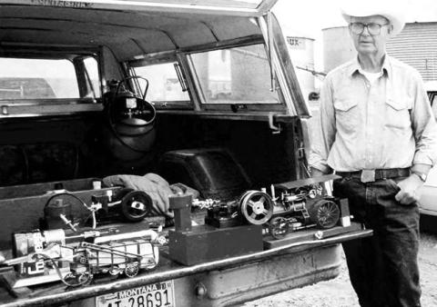 Ray Moland with some of his miniature farm machines