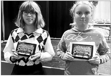 Eighth grader River Boysen and sixth grader Evelyn Gill received the “Good Attitude” awards for Middle School Band from teacher Julie Barnica.