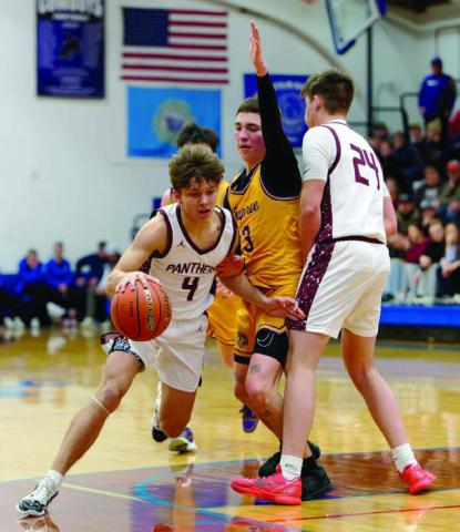 Broc Bauer (4) dribbles around a screen set by teammate Kanton Hunt (24) on Dupree’s Dayson Kennedy during the LMC Boys Basketball Tournament title game last Saturday. Topic Photo/Marie DuPreez