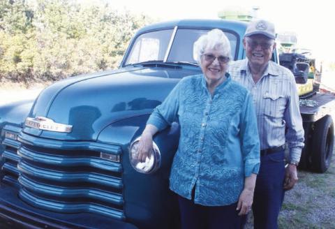 Harold and Lois Arnold of rural McIntosh will sell their collection of vintage vehicles on Saturday and don’t plan to keep even one “favorite.” Photo by Jon Flatland