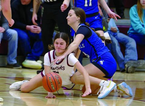 Kylie Lawrence (left) recoils from a forearm to the face while diving for a loose ball in Timber Lake’s loss to Lemmon in girls basketball action last Friday, Dec. 12. Timber Lake travels to New Underwood for a noon tip-off on Saturday, Dec. 20. Topic Photo/Marie DuPreez