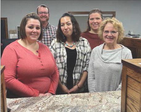 Staff at Western Dakota Bank (FRONT) L-R: Jennifer Bollinger (cashier), Amy Taylor (teller), Karma Nash (senior vice-president); BACK: Rusty Gebhardt (senior vice-president) and Kayla Kennedy (teller). President John Templer is not pictured but plans to attend the grand reopening. Photo by Jon Flatland
