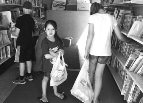 When the St. Joseph’s Bookmobile stopped at Timber Lake in 2019, Leah Eigelaar (CENTER) found some books to take home. Last year the Bookmobile did not tour due to the COVID-19 pandemic.