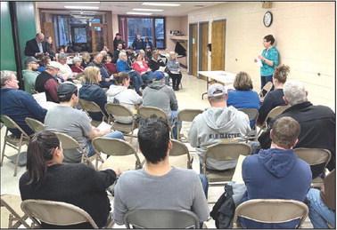 Timber Lake Ambulance Service Director Chris Hermes discusses some of requirements rural ambulance services must adhere to to maintain their license during a public meeting about the future of the service last Thursday, April 4. Nearly 50 people turned out to express their concern over the possibility the service may be discontinued due to staff shortages. The meeting was sponsored by the Timber Lake Topic.