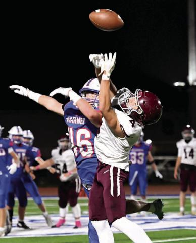A Warner defender knocks a pass away from Timber Lake receiver Broc Bauer during the first-round of the Class A football playoffs last Thursday in Warner. Photo courtesy of Robb Garofalo/The Aberdeen Outsider
