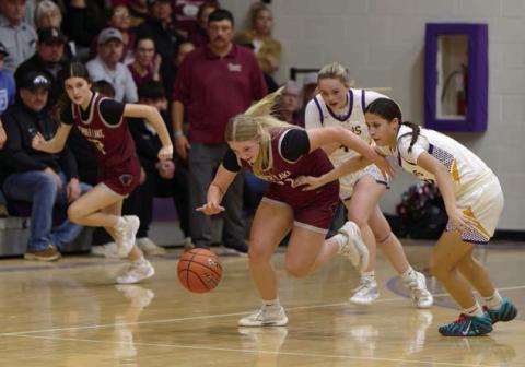 Timber Lake’s Maddy Hermes makes a steal and heads up-court while teammate Kylie Lawrence (left) fills a lane for a fast-break and Panther Head Coach Tuffy Thompson (maroon shirt) looks on. Topic Photo/Marie DuPreez